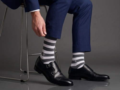 Luxury bamboo socks with formal brown leather shoes and navy suit styling for premium men’s fashion by Kikitoes