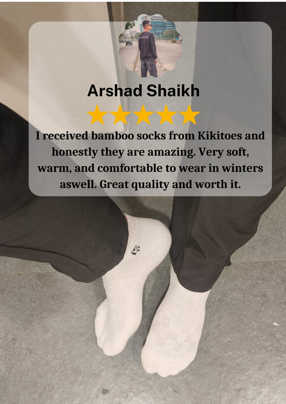 Customer wearing white Kikitoes bamboo socks indoors with 5-star review highlighting softness, warmth, and winter comfort.